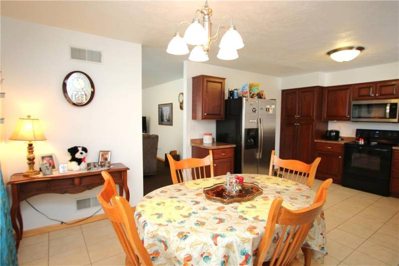 HUGE Eat-in Kitchen offering lots of Quality Cherry Cabinetry