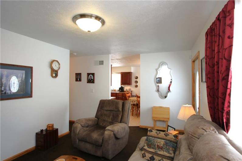 Large Living Room flows Nicely into Eat-in Kitchen. Attractive Wood Trim Baseboard throughout home