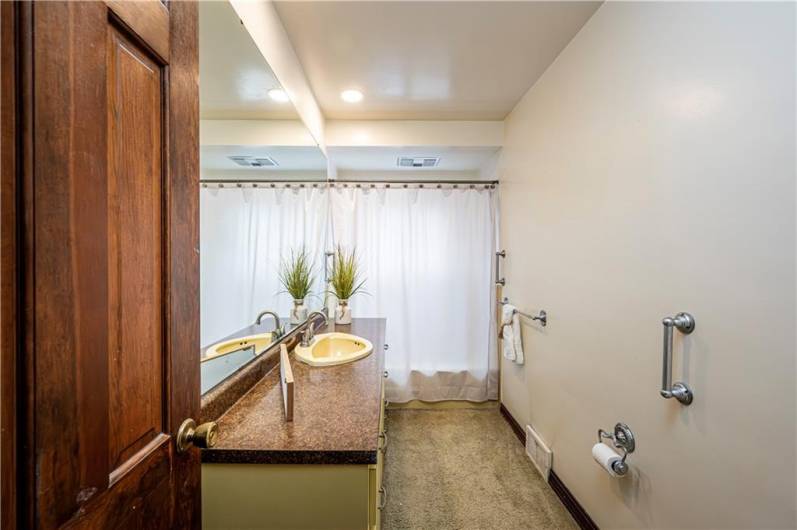 This convenient full bath is located right by the primary bedroom and family area.