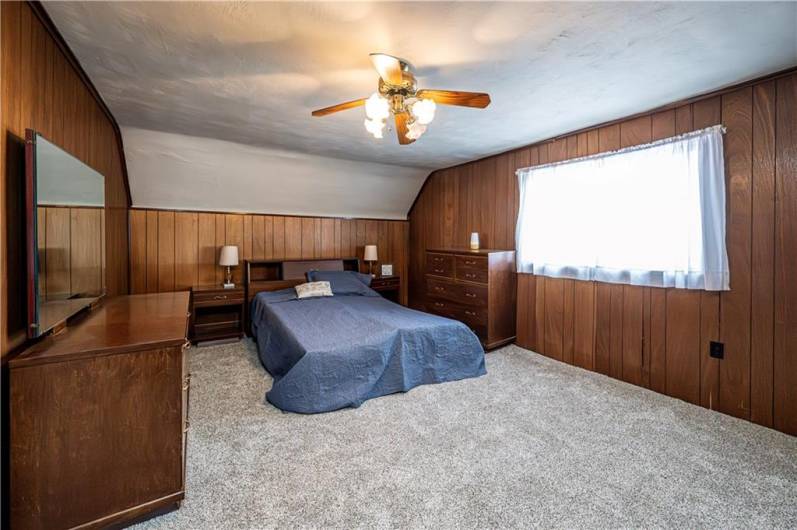 This is the spacious open loft area bedroom on the upper level.