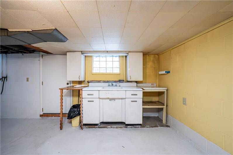 You can come in from the outside with the side entry door and clean with this great sink area.