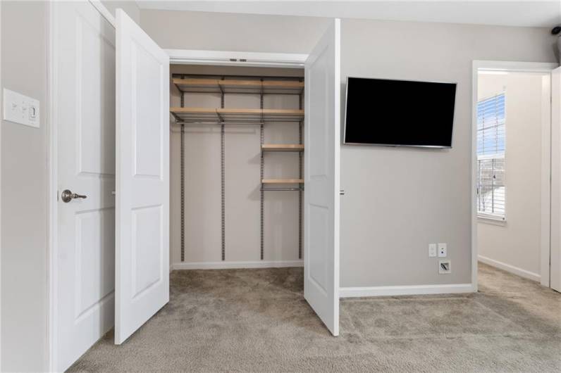 Double wide closet with organizers.