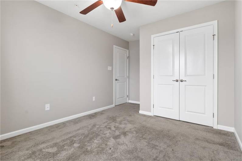 Second bedroom with double wide closet.