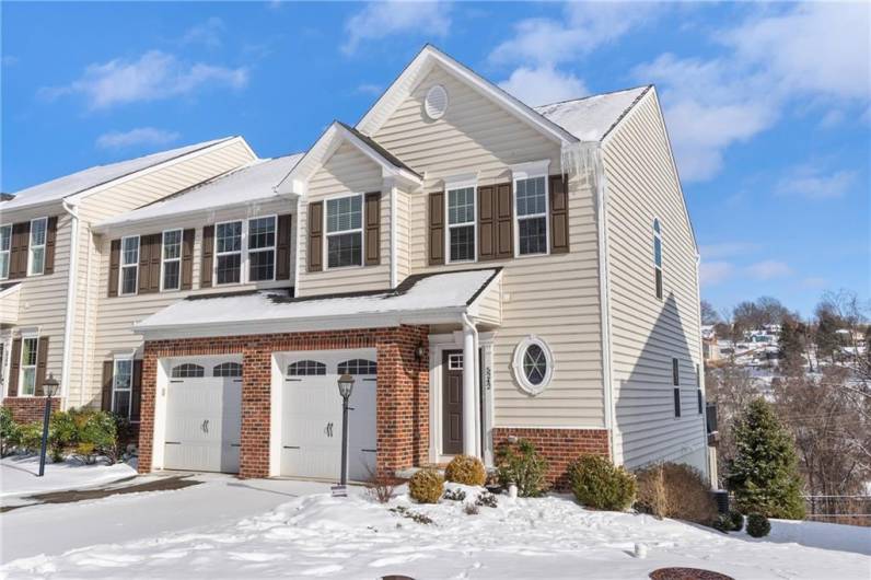 The end unit has access to the rear patio around the side of the building and also has additional off street parking across the street for guests.