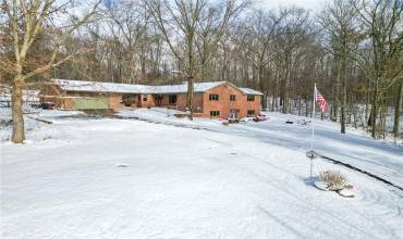 Custom built, brick ranch on 9.58 picturesque acres with views of the Shenango River Lake.