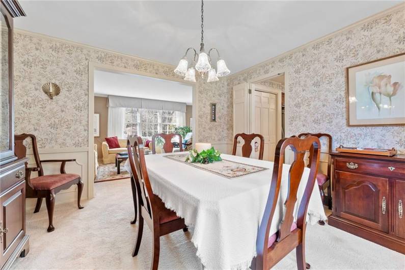 From this view you can see that the dining room flows nicely into the formal living room and the kitchen is off to the right.