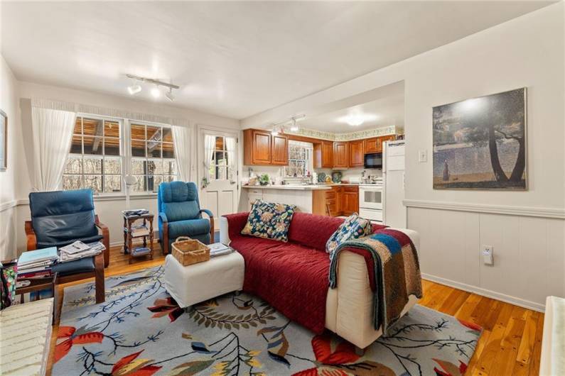 Look how warm and inviting this family room is and how nicely It flows into the kitchen and straight ahead is access to the sunroom, to the right will be the entryway