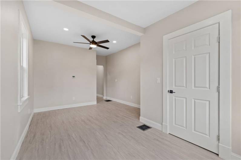 Living Room with Fresh Flooring, Fresh Paint and New Fixtures