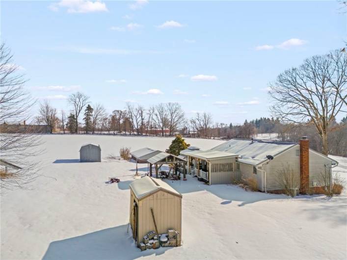 Great view of house, 2 sheds and pavilion