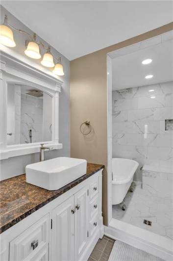 The vessel sink adds a nice touch to this updated bathroom...