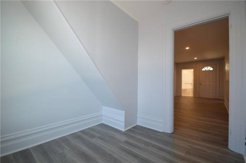 view from bedroom to Dining area  Bathroom in background  Door on right leads to deck