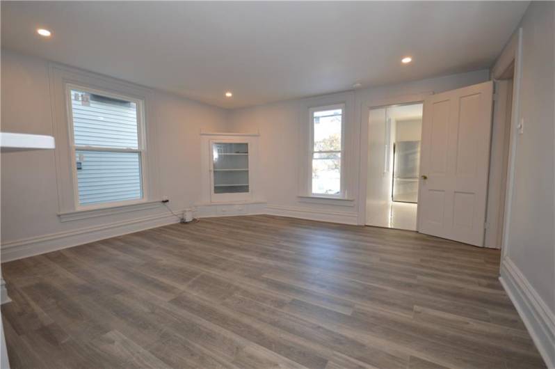 entrance to living room from front door steps kitchen straight ahead