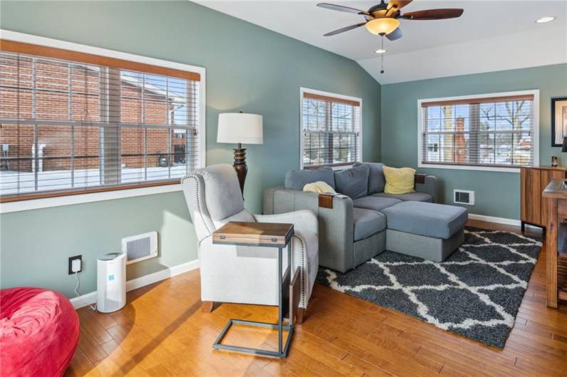 This home features a family room flanked by windows