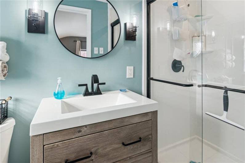 The updated master bath has a spa-like feel