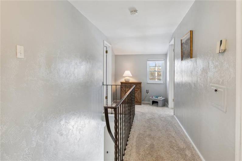 2nd floor hallway features a window for more natural light