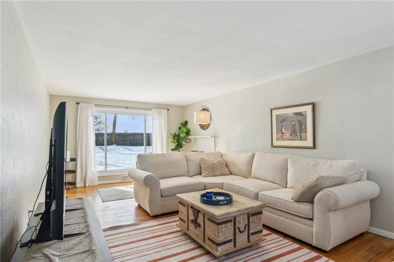 Living room with a floor-to-ceiling window allowing unobstructed views and letting in plenty of natural light