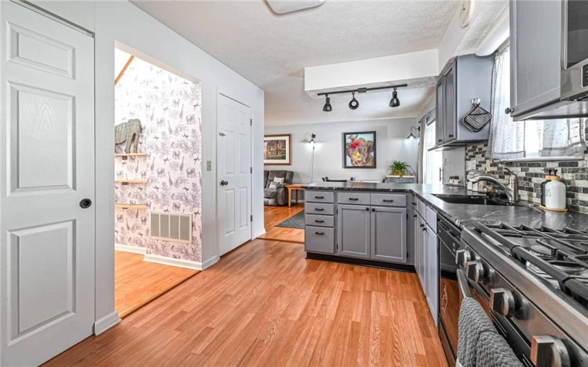 Kitchen with new countertops and cabinets that have been refinished