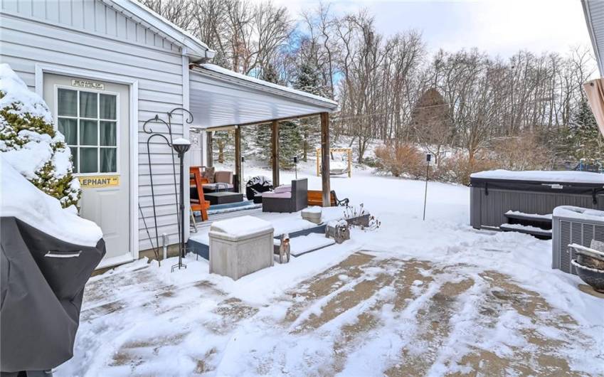 Back patio leading to the additional garage/workshop and outdoor entertainment area