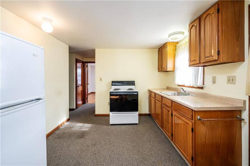 BOTH KITCHENS INCLUDE ELECTRIC STOVE AND REFRIGERATOR