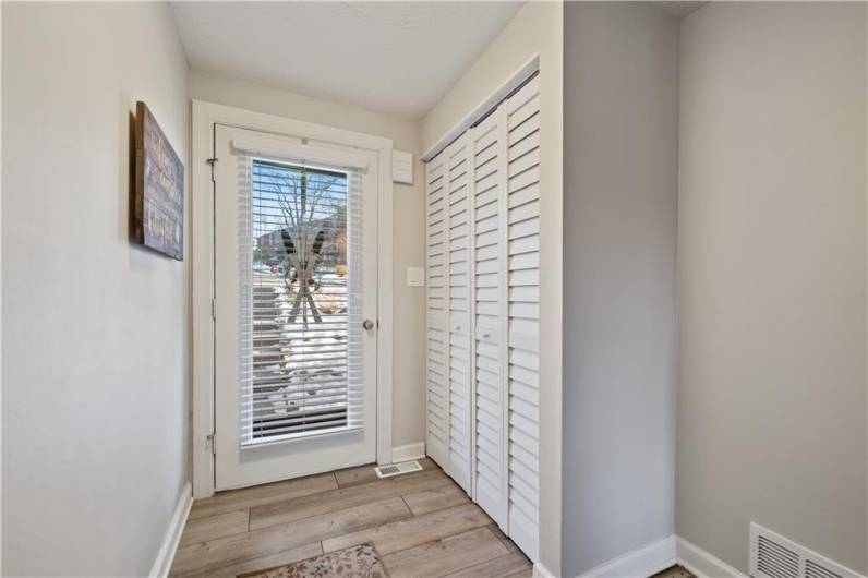 Greet guests in a lovely entry with large coat closet...