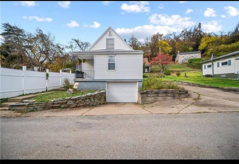 Flat side yard and large parking pad