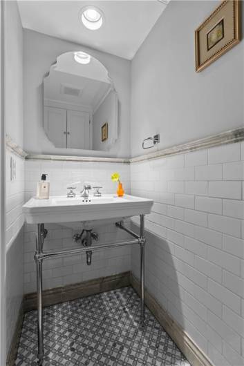 Stunning Main Level Powder Room with Exquisite Tile Flooring