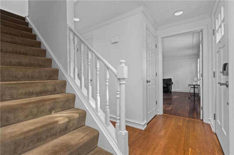 Welcoming Entry With Hardwood Flooring