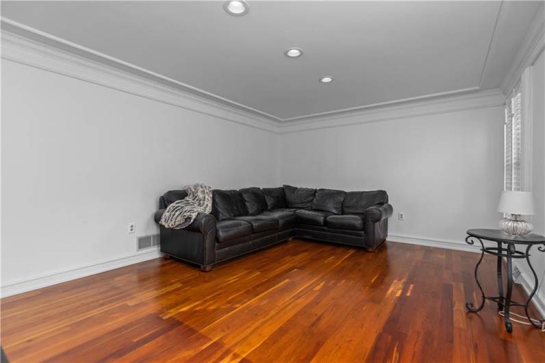 Spacious Living Room with Stunning Hardwood Flooring