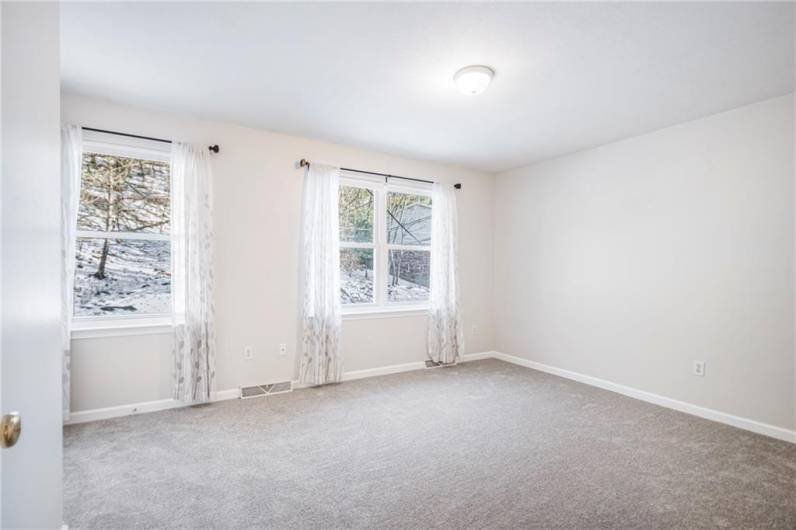 Primary Bedroom with new carpet.