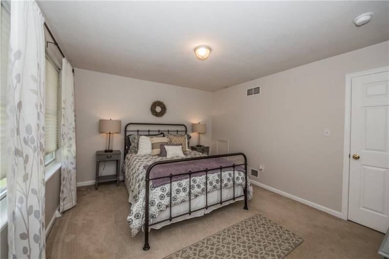 Primary bedroom, furnished, before replacing carpet.