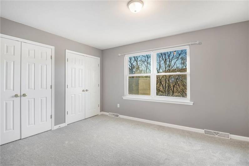 Second bedroom with new carpet.