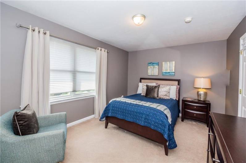 Second bedroom, furnished, before replacing carpet.