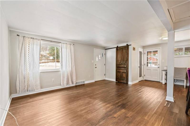 Beautiful flooring and open to kitchen