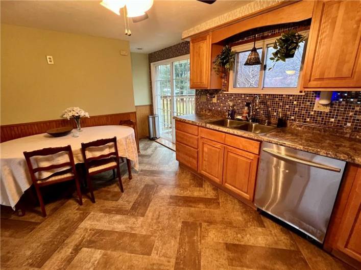 Sliding door off the kitchen leads to the massive back deck!