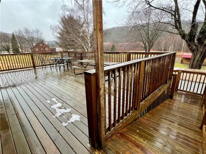 Deck has a nice wooden ramp with landing and turns down to the driveway!