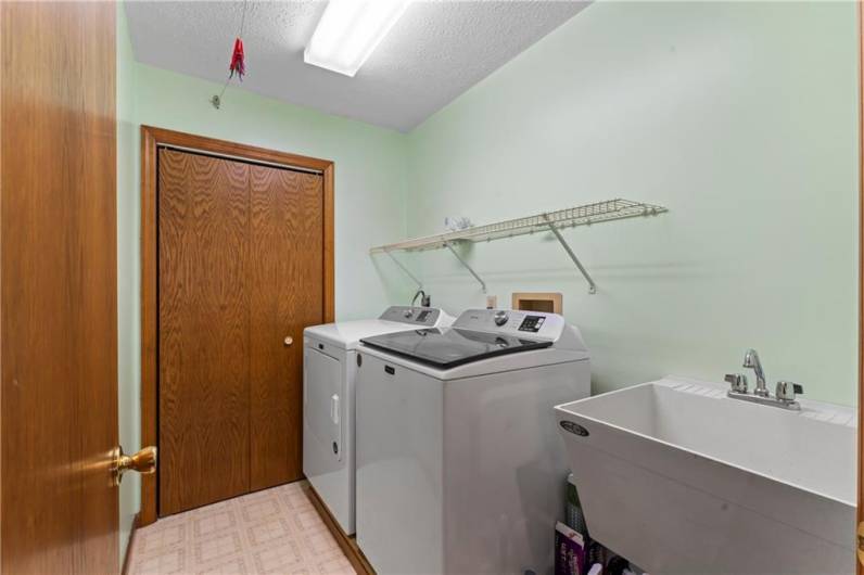 1st floor laundry area with closet