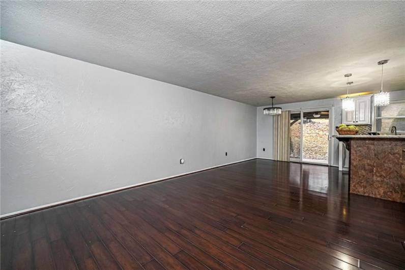 This open concept floor plan offers an inviting flow connecting the kitchen, dining and living area.