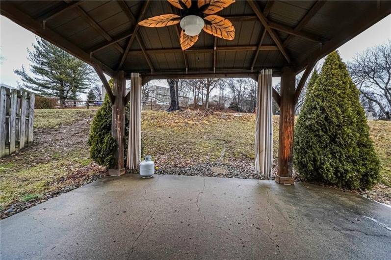 The covered patio provides the ideal setting for hosting barbeques or a shaded space for the kids to play.