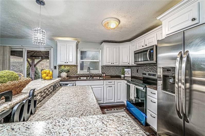 A mosaic tile backsplash is the perfect accent to this space!