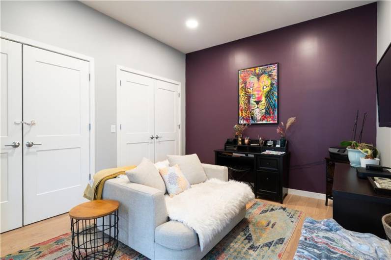 Oak hardwood floors, recessed lighting. Laundry room behind doors on left.