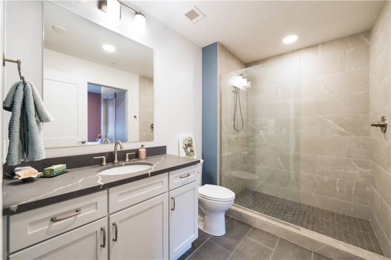 Full 2nd bathroom. Ceramic tile shower and floors. Granite vanity.