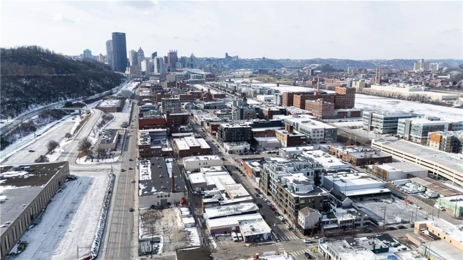 Aerial view, building lower right, downtown in the distance.