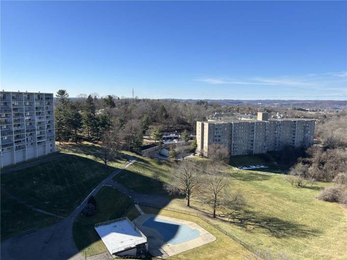 Balcony view overlooking the beautifully landscaped grounds. The pool will be open before we know it!