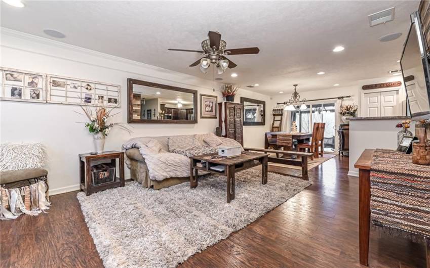 Spacious living room is open to the dining & kitchen area. Updated floors throughout!