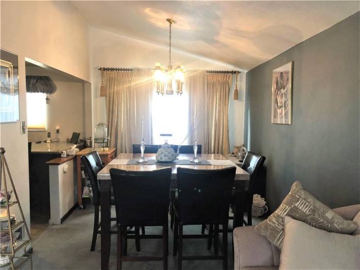 Dining room with vaulted ceiling