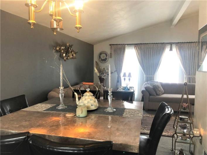 Dining room with vaulted ceiling