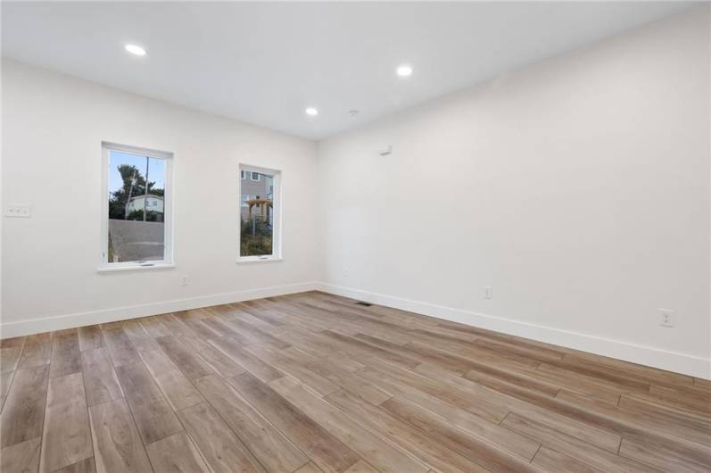 Modern open floor plan on the main level is filled with light