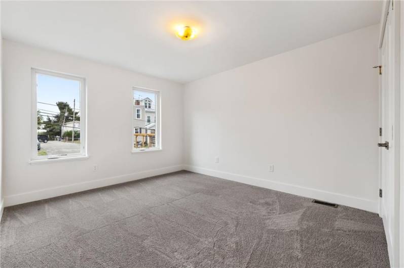 Sunny bedrooms with new carpet and big closets