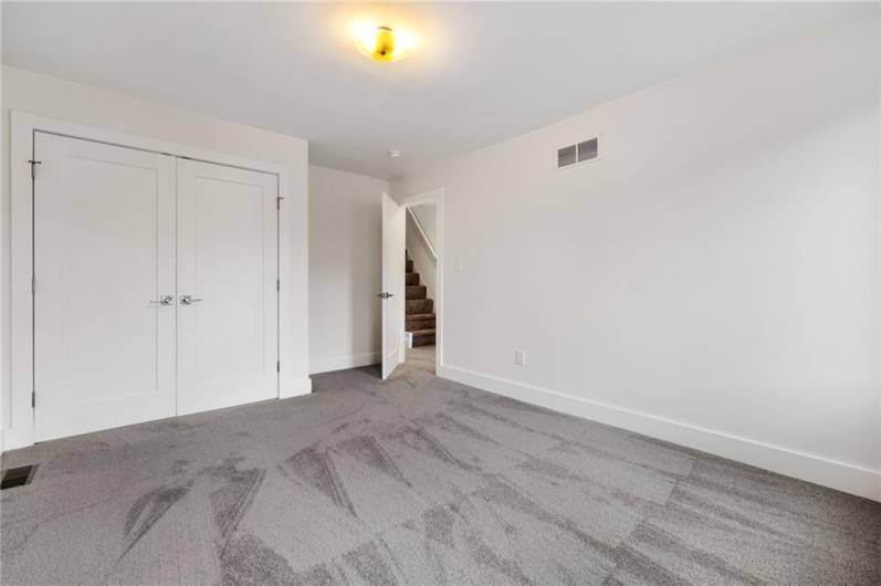 Sunny bedrooms with new carpet and big closets