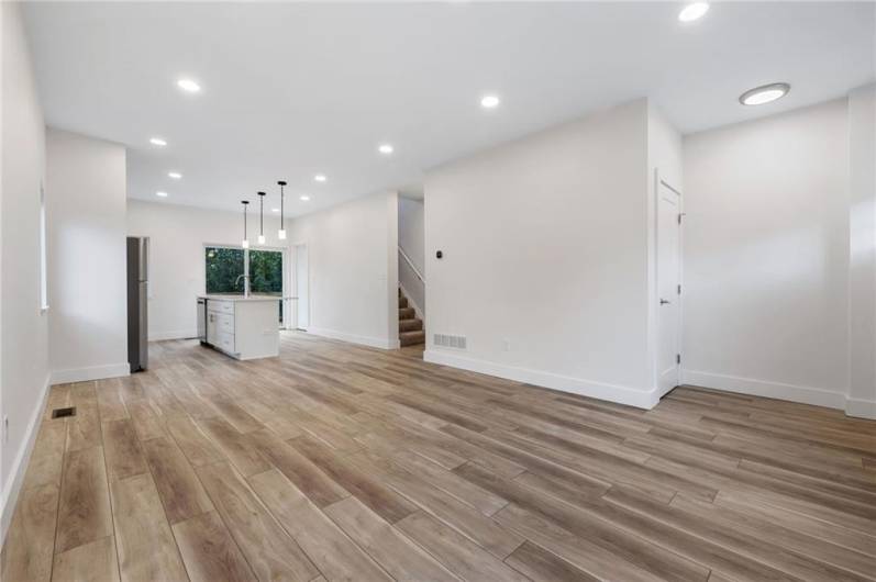 Modern open floor plan on the main level is filled with light